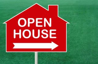 open house sign on lawn