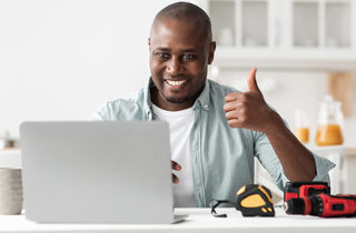 Man reviewing renovation plans on computer
