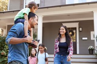 family outside of house