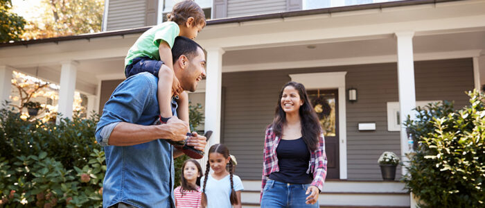 family outside of house