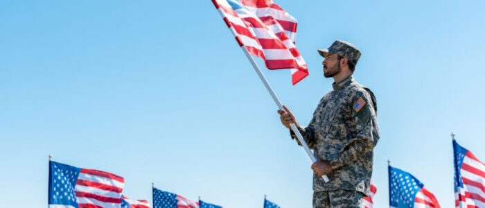 military man holding American flag