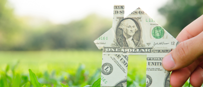 House Made of Dollar Bill on Grassy Field