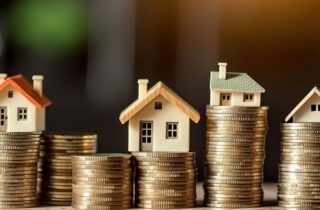 coins and miniature houses