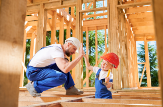 Father and Child Building Wood Frame Together